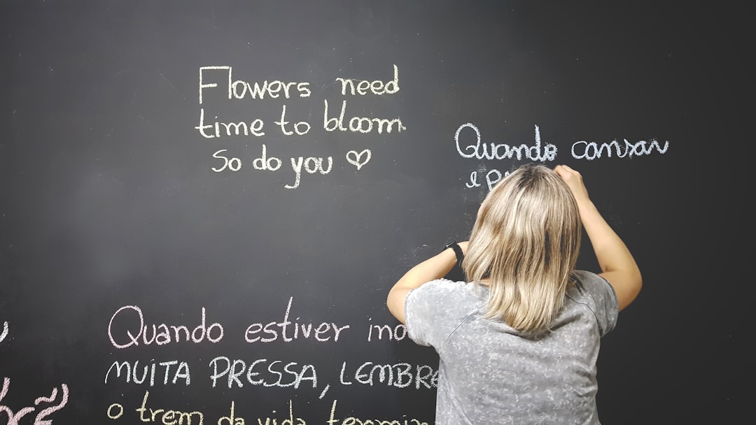 unknown-person-writing-on-chalkboard-jbstnenqxok